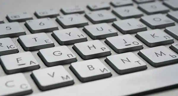 A close-up of a laptop keyboard showing the F, G and H keys